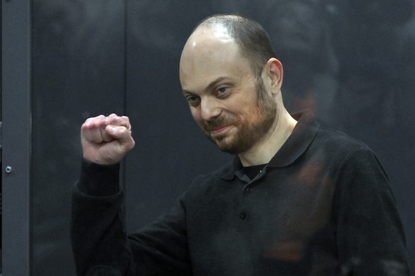 FILE - Russian opposition activist Vladimir Kara-Murza gestures standing in a defendant?s cage in a courtroom during the announcement of an appeal of his verdict in Moscow, Russia, on July 31, 2023. K ...