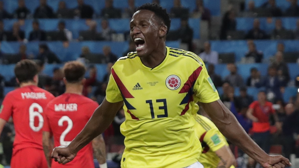Colombia's Yerry Mina celebrates after scoring his first side's goal during the round of 16 match between Colombia and England at the 2018 soccer World Cup in the Spartak Stadium, in Moscow, ...
