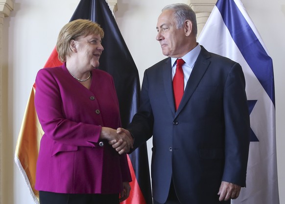 epa07068884 Israeli Prime Minister Benjamin Netanyahu and German Chancellor Angela Merkel pose for photographers between meetings in Jerusalem, 04 October 2018. Merkel arrived in Israel for a two-day  ...