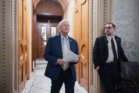 Sen. Roger Wicker, R-Miss., leaves the chamber as the Senate works to bring the longest government shutdown in U.S. history to an end after a bipartisan compromise, at the Capitol in Washington, Monda ...