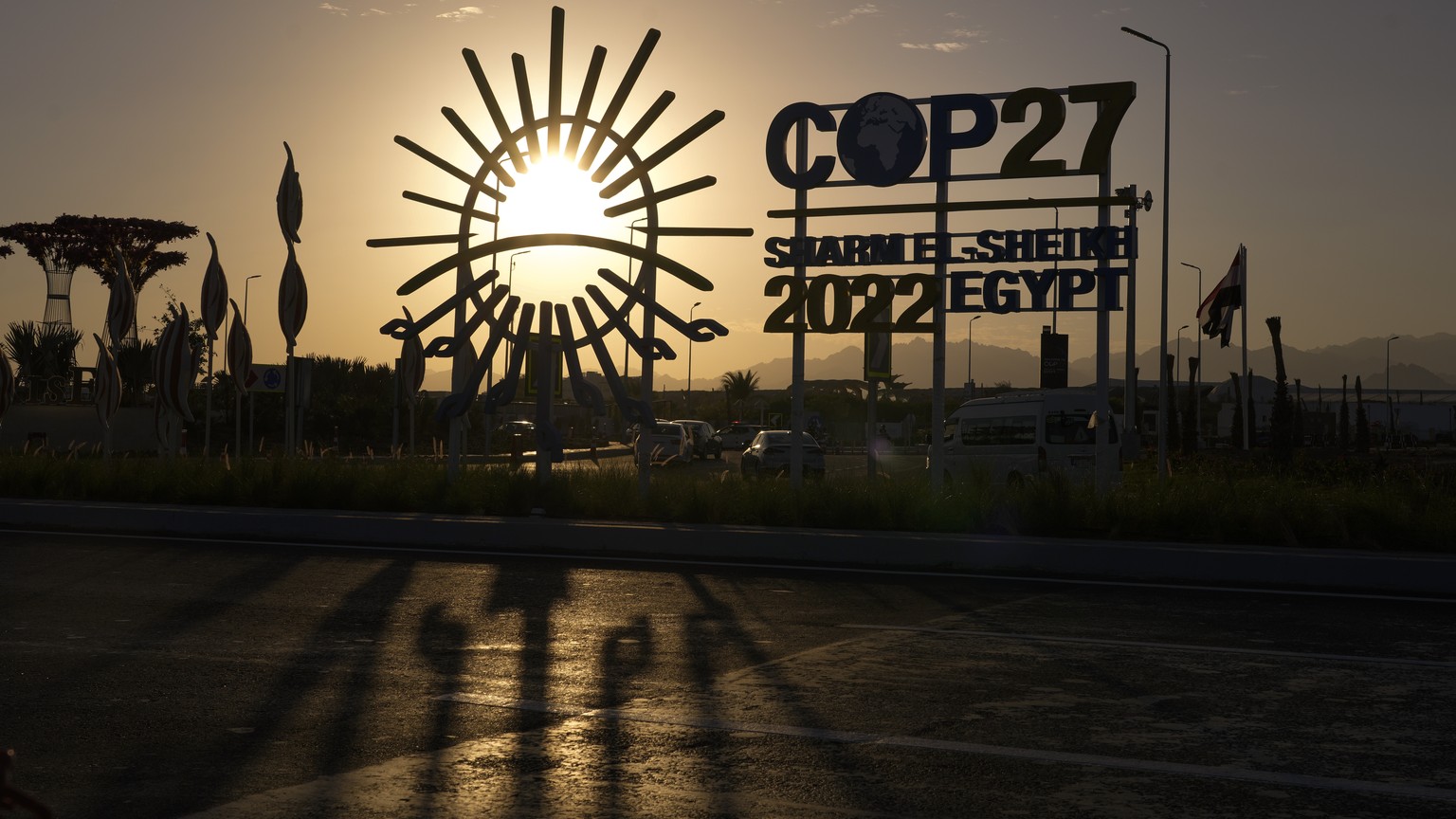 The sun sets behind the COP27 logo outside the venue of the COP27 U.N. Climate Summit, Saturday, Nov. 12, 2022, in Sharm el-Sheikh, Egypt. (AP Photo/Peter Dejong)