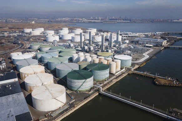 epa09815083 A picture taken with a drone shows a tank terminal that handles storage of crude and refined petroleum, or crude oil, as well as other bulk industrial liquids, in Bayonne, New Jersey, USA, ...