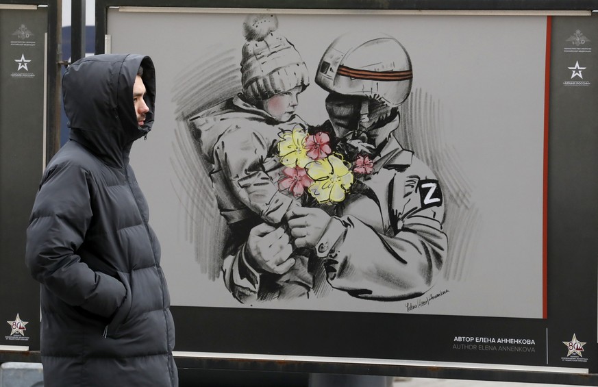 epa11228026 Pictures by various Russian artists are on display at the street military exhibition &#039;We bring Peace&#039; in St. Petersburg, Russia, 18 March 2024. Later today, a rally and a concert ...