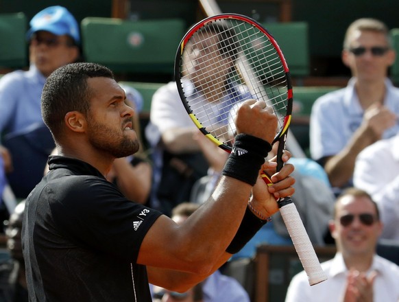 Jo-Wilfried Tsonga of France reacts during his men&#039;s quarter-final match against Kei Nishikori of Japan during the French Open tennis tournament at the Roland Garros stadium in Paris, France, Jun ...