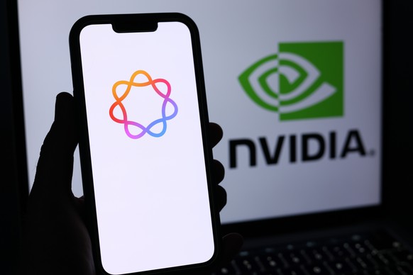 epa13026206 The Apple AI and Nvidia logos are displayed on a mobile phone and laptop screen in Liverpool, Britain, 09 June 2026. Leading AI (artificial intelligence) and technology companies Anthropic ...
