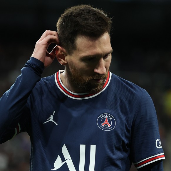 epa09813765 Paris Saint-Germain&#039;s forward Leo Messi reacts after the UEFA Champions League round of 16 second leg soccer match between Real Madrid and Paris Saint-Germain (PSG) in Madrid, Spain,  ...