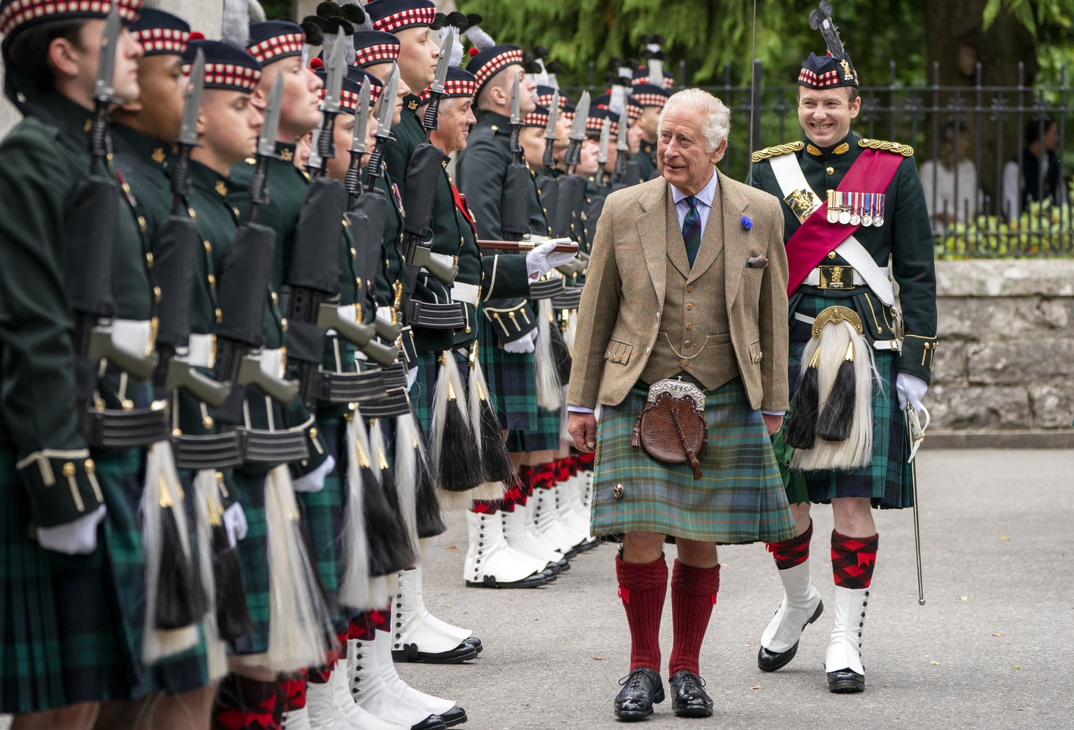 Britain&#039;s King Charles III inspects Balaklava Company, 5th Battalion, The Royal Regiment of Scotland, at the gates of Balmoral, Scotland, Monday Aug. 21, 2023, as he takes up summer residence at  ...