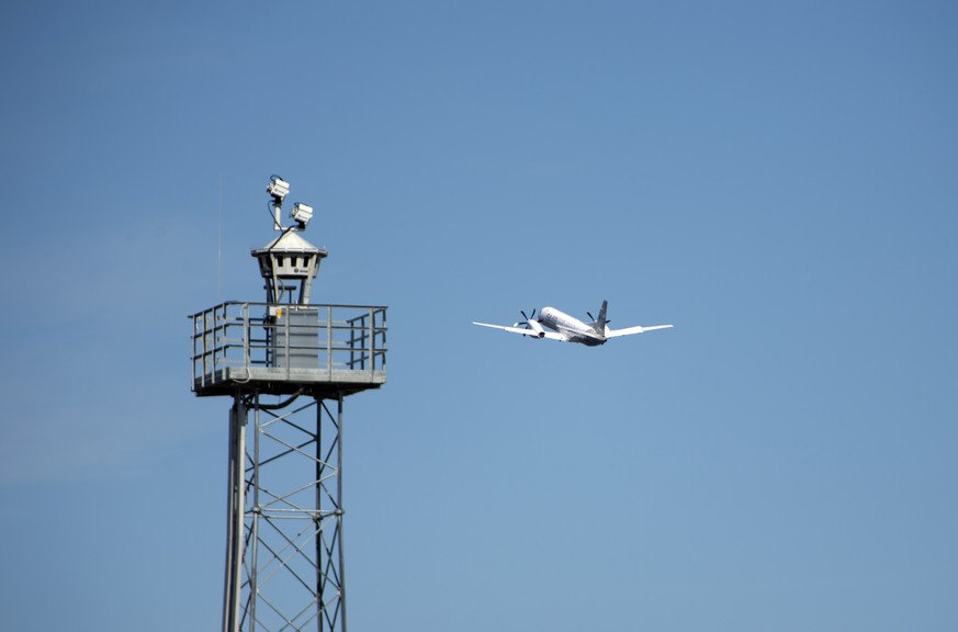 In this April 2015 photo provided by Saab AB, a plane takes off beyond a remotely controlled control tower at Ornskoldsvik Airport in northern Sweden. The dozen commercial planes that land here each d ...