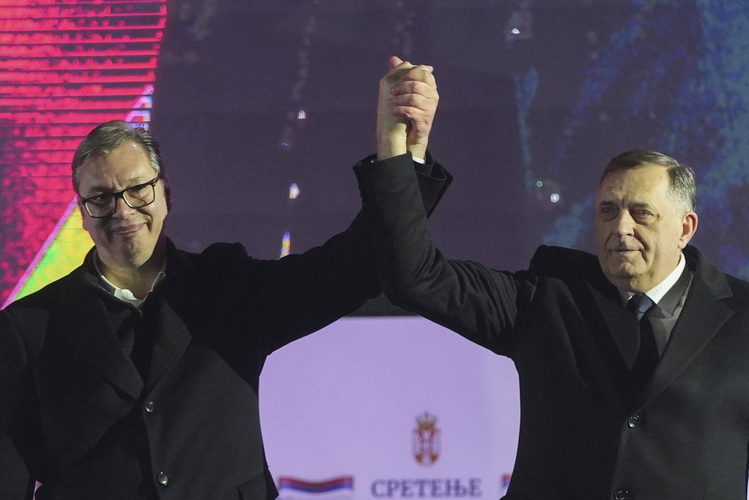 Serbian President Aleksandar Vucic, left, poses with Bosnian Serb political leader Milorad Dodik during a rally marking the country&#039;s Statehood Day in Sremska Mitrovica, Serbia, Saturday, Feb. 15 ...