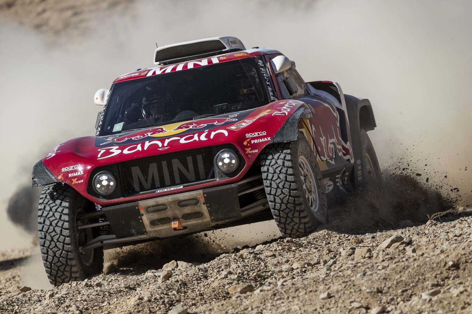 Driver Stephane Peterhansel, of France, and co-driver Paulo Fiuza, of Portugal, race their Miniduring stage nine of the Dakar Rally between Wadi Al Dawasir and Haradth, Saudi Arabia, Tuesday, Jan. 14, ...