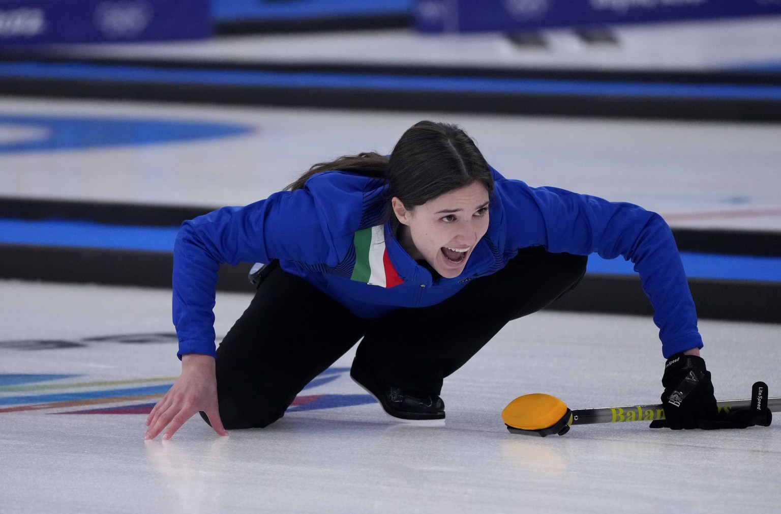 Italy&#039;s Stefania Constantini, directs her team mate, during the mixed doubles curling match against Sweden, at the 2022 Winter Olympics, Sunday, Feb. 6, 2022, in Beijing. (AP Photo/Nariman El-Mof ...
