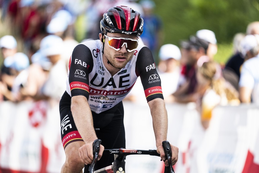 Marc Hirschi from Switzerland of UAE Team Emirates reacts after the fifth stage, a 193 km race from Ambri to Novazzano, at the 85th Tour de Suisse UCI ProTour cycling race, on Thursday, June 16, 2022. ...