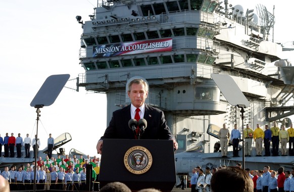 FILE - In this May 1, 2003, file photo, President George W. Bush declares the end of major combat in Iraq as he speaks aboard the aircraft carrier USS Abraham Lincoln off the California coast. (AP Pho ...