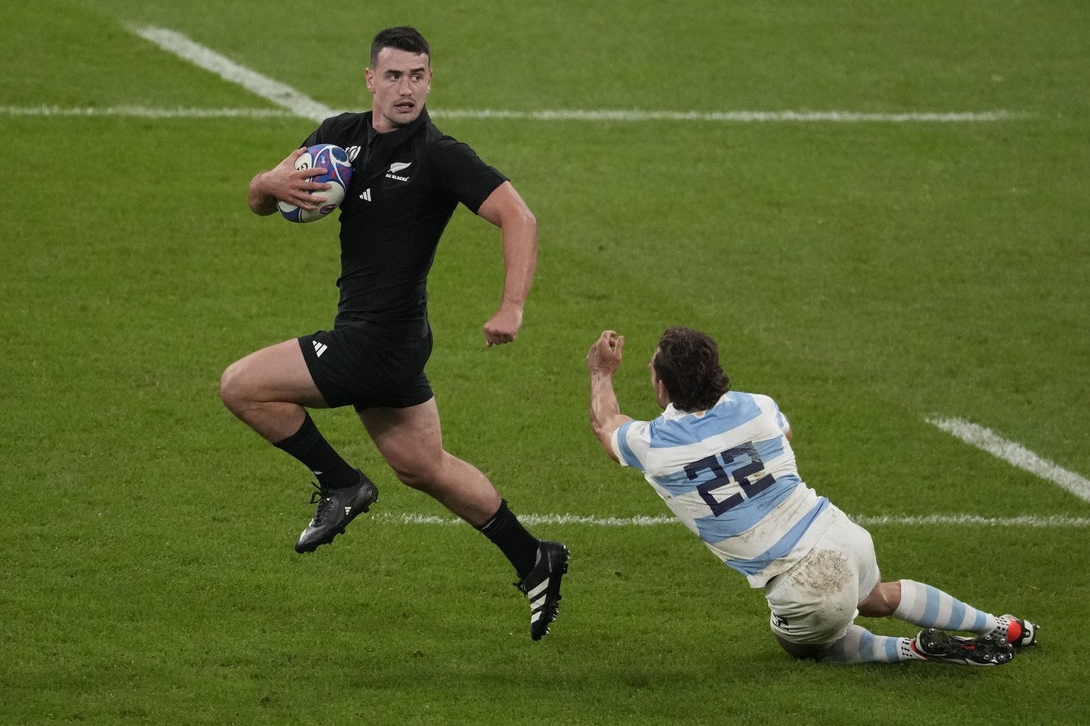 New Zealand's Will Jordan runs on to score his third try during the Rugby World Cup semifinal match between Argentina and New Zealand at the Stade de France in Saint-Denis, outside Paris, Friday, ...