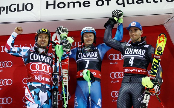 Alpine Skiing - FIS Alpine Skiing World Cup - Men&#039;s Slalom race 2nd run - Madonna di Campiglio, Italy - 22/12/16 - First placed Henrik Kristoffersen of Norway (C) celebrates on the podium with se ...