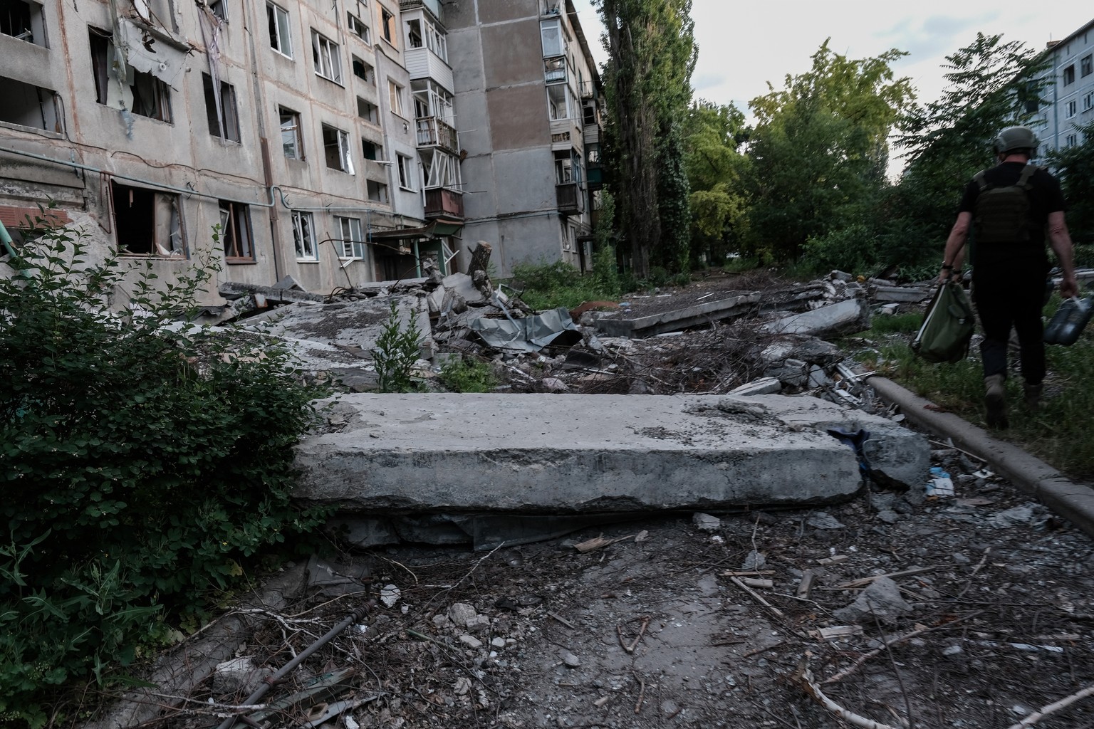 epa12170503 A street in the Ukrainian city of Myrnohrad on the Pokrovsk (Donetsk) frontline is completely shelled, 11 June 2025. The city has been heavily besieged for months by Russian troops, who ar ...