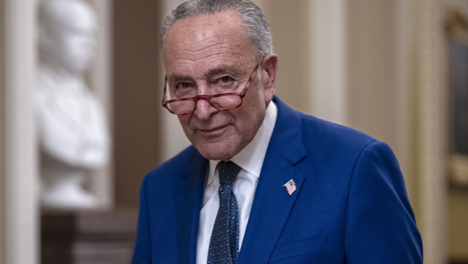 Senate Majority Leader Chuck Schumer, D-N.Y., walks to his office at the Capitol in Washington, Thursday, July 27, 2023. Before adjourning for the August recess, Schumer worked to authorize appropriat ...