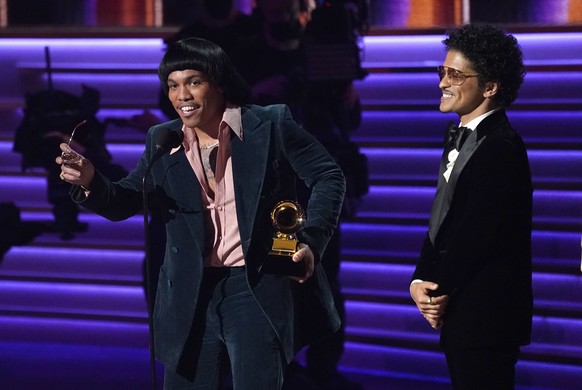 Anderson .Paak, left, and Bruno Mars of Silk Sonic accept the award for record of the year for &quot;Leave the Door Open&quot; at the 64th Annual Grammy Awards on Sunday, April 3, 2022, in Las Vegas.  ...