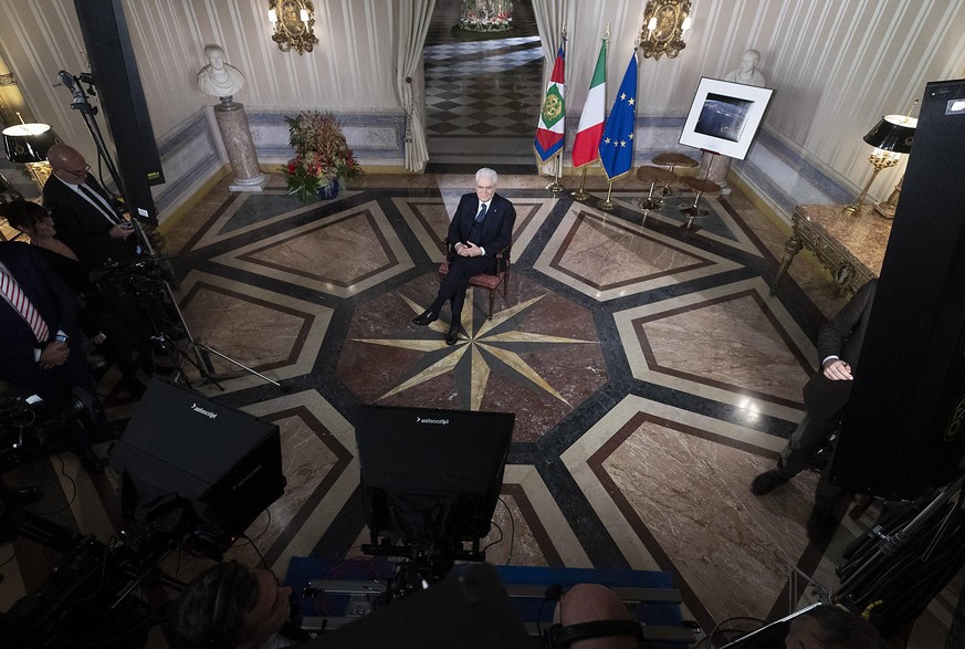 epa08096614 A handout photo made available by the Italian Presidential Press Office showing Italian President, Sergio Mattarella, during the year-end speech to Italians at Quirinale Palace in Rome, It ...