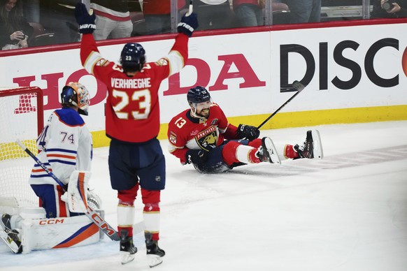Florida Panthers&#039; Sam Reinhart (13) celebrates his goal against Edmonton Oilers goalie Stuart Skinner (74) as Panthers&#039; Carter Verhaeghe (23) reacts during the first period in Game 6 of the  ...