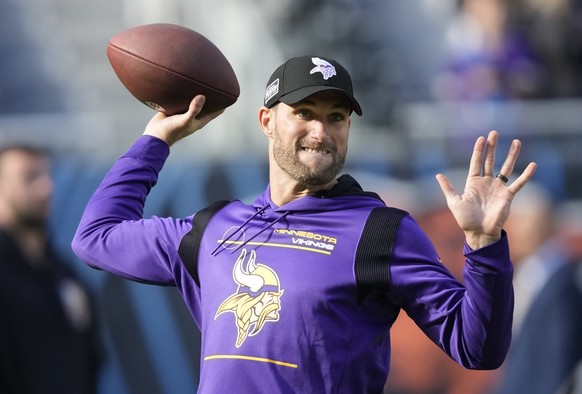 Minnesota Vikings quarterback Kirk Cousins throws during warmups before an NFL football game against the Chicago Bears, Sunday, Oct. 15, 2023, in Chicago. (AP Photo/Charles Rex Arbogast)