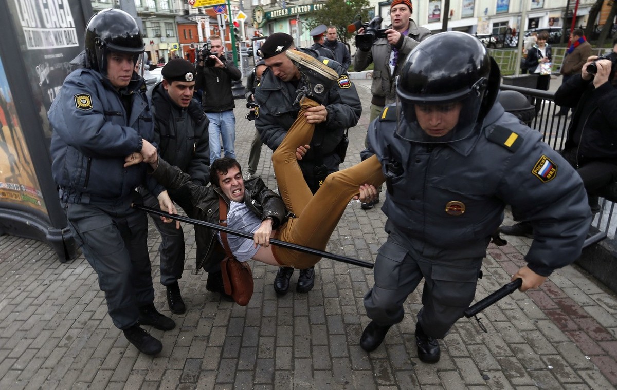 Police officers detain political activist Roman Dobrokhotov during the unauthorized meeting to mark Russian President Vladimir Putin&amp;#039;s birthday in Moscow, Sunday Oct. 7, 2012. Vladimir Putin  ...