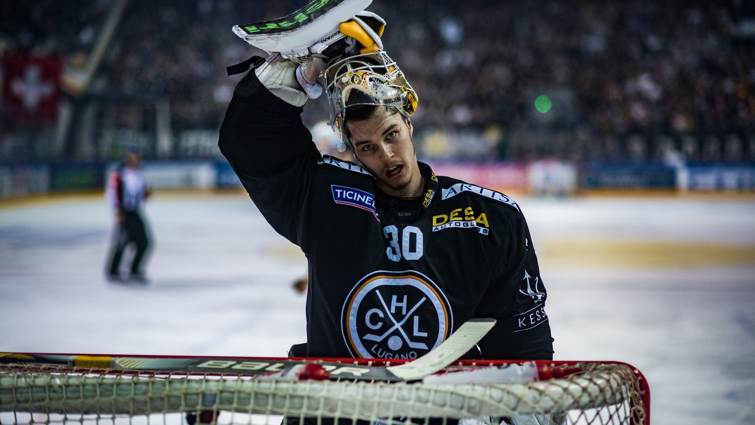 Lugano&#039;s goalkeeper Elvis Merzlikins reacts during the first match of the playoff final of the National League between HC Lugano and ZSC Lions, at the ice stadium Resega in Lugano, on Thursday, A ...