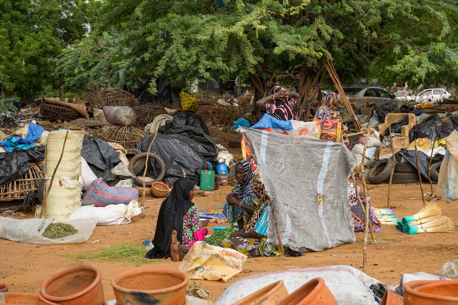 epa10780349 A group of women sell their produce at a market in Niamey, Niger, 01 August 2023. General Tchiani declared himself the new leader of Niger following a coup against democratically elected P ...