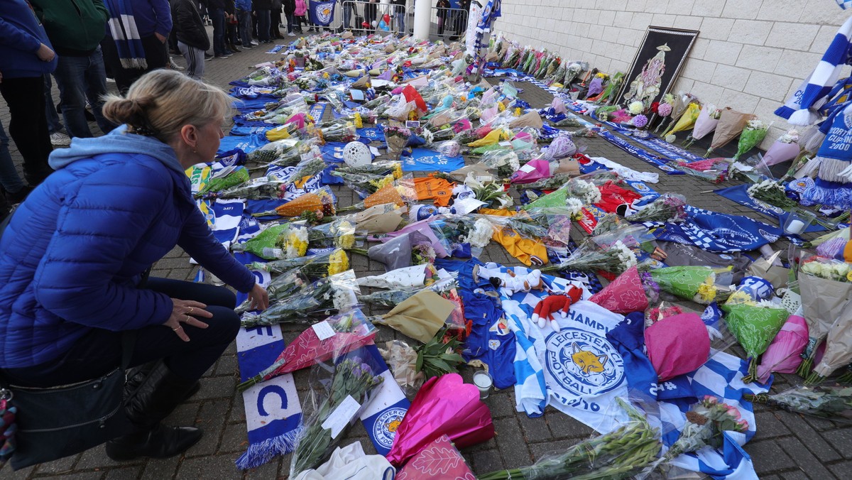 Flowers are placed outside Leicester City Football Club after a helicopter crashed in flames the previous day, in Leicester, England, Sunday, Oct. 28, 2018. A helicopter belonging to Leicester City  ...