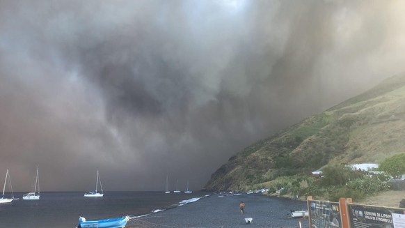 epa11455518 An intense cloud of lava ash and pyroclate material rises on Stromboli from the Sciara del Fuoco, Italy, 03 July 2024. According to the first findings of the National Institute of Geophysi ...