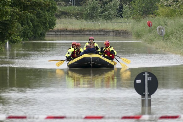 Firefighters use a dinghy to evacuate people near Faenza, Italy, Wednesday, May 3, 2023. Heavy rains have caused flooding in Italy's densely populated Emilia-Romagna region, killing at least two people as...