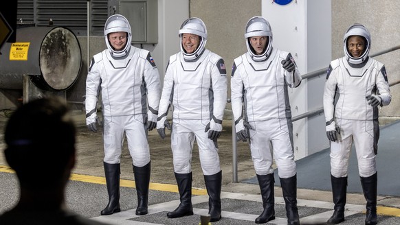 epaselect epa11197754 Members of the NASA SpaceX Crew-8 (L-R) Roscosmos cosmonaut mission specialist Alexander Grebenkin; NASA astronaut Michael Barratt, pilot; NASA astronaut Matthew Dominick, comman ...