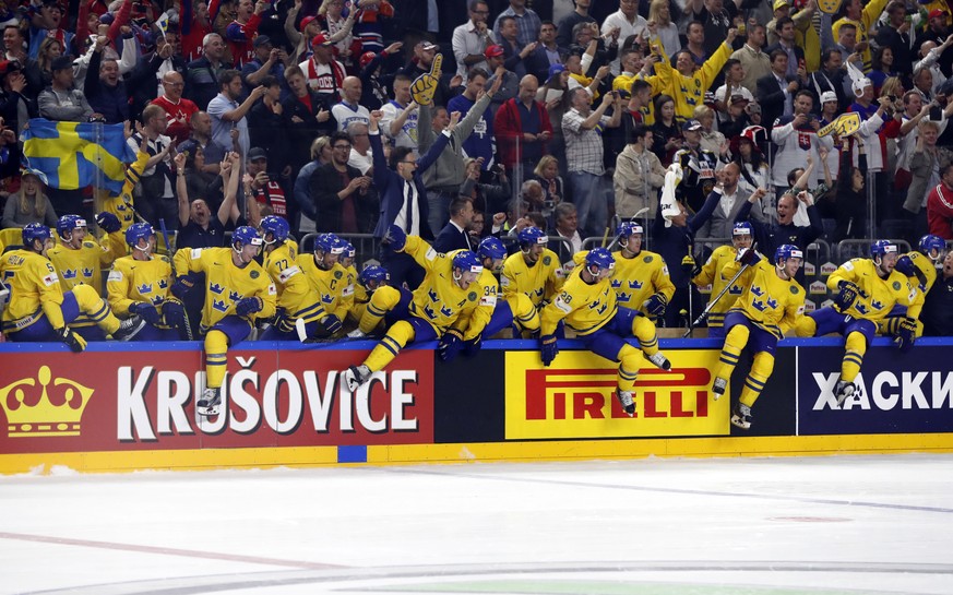 Sweden players celebrate their victory in the Ice Hockey World Championships final match between Canada and Sweden in the LANXESS arena in Cologne, Germany, Sunday, May 21, 2017. (AP Photo/Petr David  ...