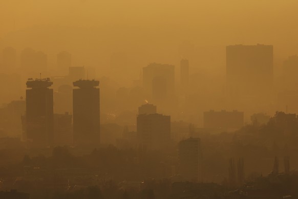 General view of the city during a sunset as smog covers Sarajevo, Bosnia, Monday, Nov. 14, 2022. (AP Photo/Armin Durgut)