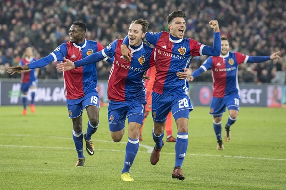 Basel&#039;s Dimitri Oberlin, Luca Zuffi and Raoul Petretta, from left to right, celebrate their score to 1:0 during an UEFA Champions League Group stage Group A matchday 4 soccer match between Switze ...