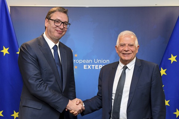 European Union foreign policy chief Josep Borrell, right, greets Serbian President Aleksandar Vucic prior to a high-level Belgrade-Pristina dialogue meeting at the EEAS building in Brussels, Tuesday,  ...