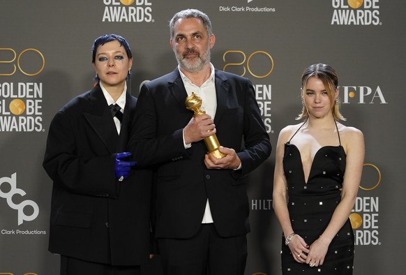 Emma D'Arcy, from left, Miguel Sapochnik and Milly Alcock pose in the press room with the award for Best Television Series, Drama for "House of the Dragon" at the 80th Annual Golden Globe Aw...
