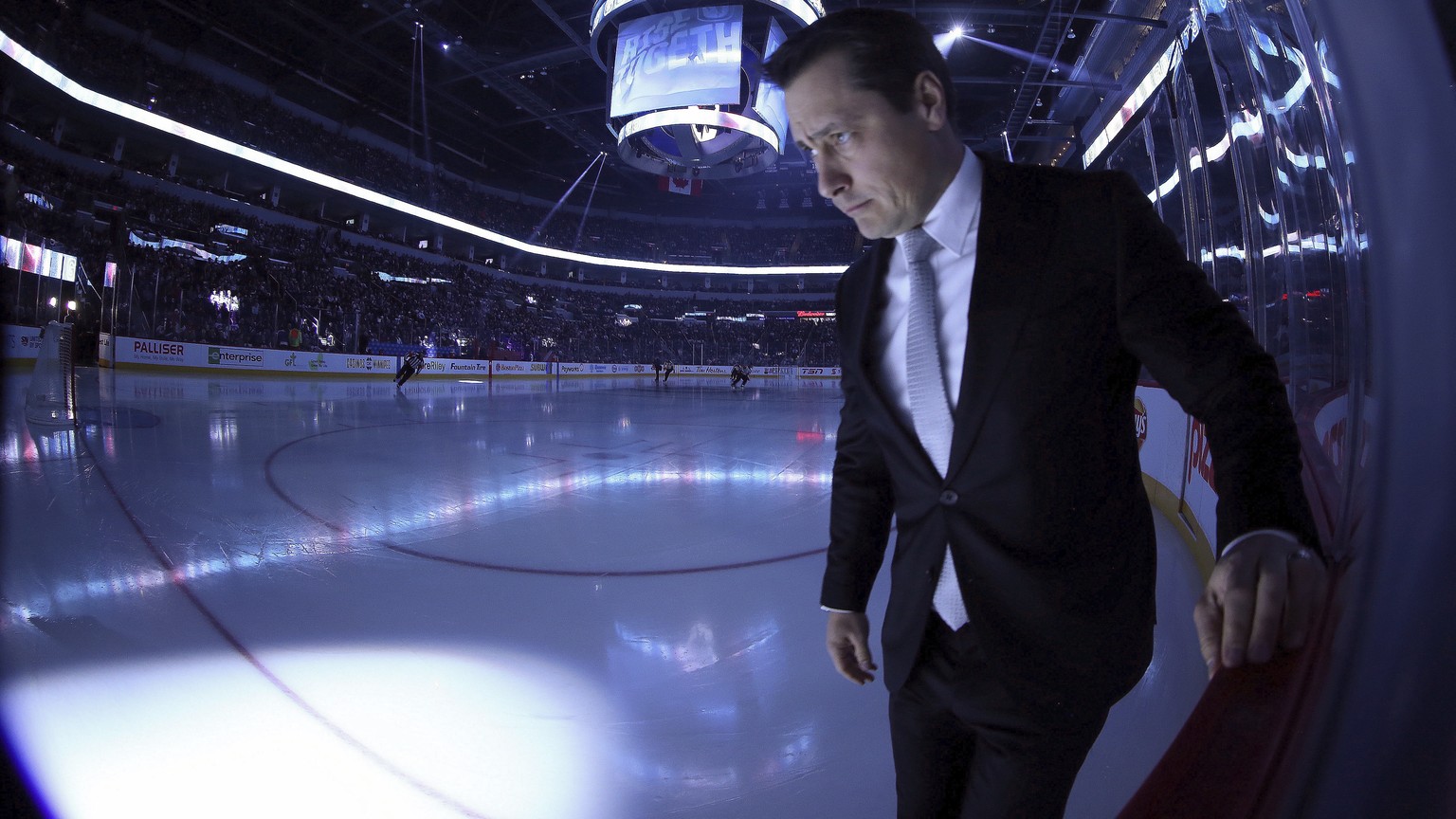 Ottawa Senators coach Guy Boucher walks toward his bench before the team&#039;s NHL hockey game against the Winnipeg Jets in Winnipeg, Manitoba, Sunday, Dec. 3, 2017. (Trevor Hagan/The Canadian Press  ...