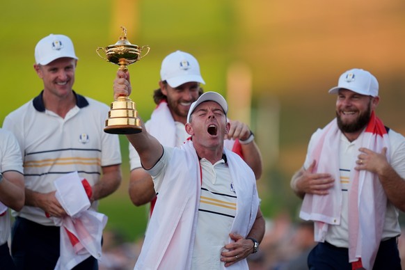 Europe&#039;s Rory McIlroy poses with the trophy after winning the Ryder Cup golf tournament against the United States on the Bethpage Black golf course, Sunday, Sept. 28, 2025, in Farmingdale, N.Y. ( ...