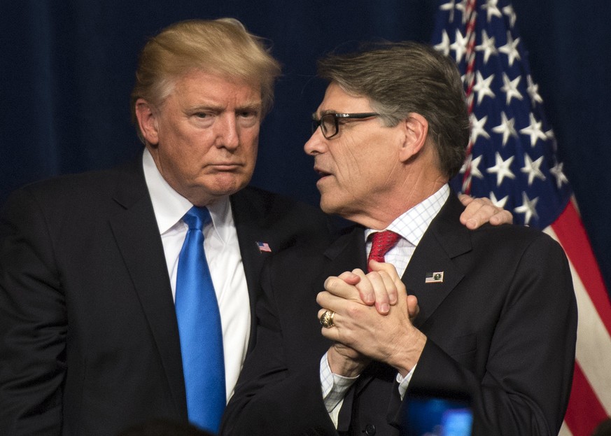 epa06056767 President Donald Trump (L) embraces Energy Secretary Rick Perry (R) after delivering remarks at the Unleashing American Energy event at the Department of Energy in Washington, DC, USA, 29  ...