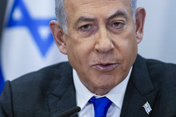 FILE - Israeli Prime Minister Benjamin Netanyahu chairs a cabinet meeting at the Kirya military base, which houses the Israeli Ministry of Defense, in Tel Aviv, Israel, on Dec. 24, 2023. Netanyahu has ...