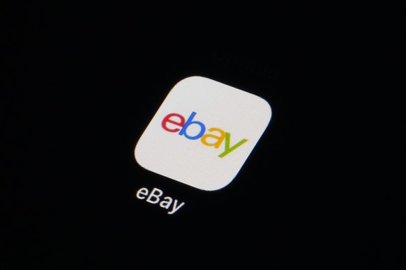 FILE - The eBay app icon is seen on a smartphone, Tuesday, Feb. 28, 2023, in Marple Township, Pa. Online retailer eBay Inc., will pay a $3 million fine to resolve criminal charges over a harassment ca ...
