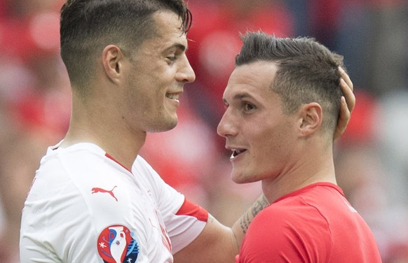 Swiss midfielder Granit Xhaka, left, cheers with his brother Albania&#039;s midfielder Taulant Xhaka, right, after the UEFA EURO 2016 group A preliminary round soccer match between Albania and Switzer ...