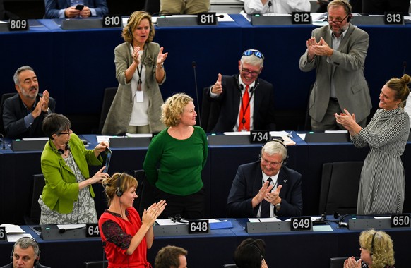 epa07014598 Rapporteur Judith Sargentini is congratulated after members of the European Parliament took part in a vote on the situation in Hungary during a voting session at the European Parliament in ...