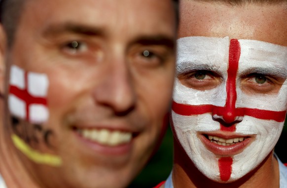England fans pose for a picture before the semifinal match between Croatia and England at the 2018 soccer World Cup in the Luzhniki Stadium in Moscow, Russia, Wednesday, July 11, 2018. (AP Photo/Rebecca Blackwell)