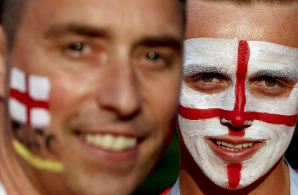 England fans pose for a picture before the semifinal match between Croatia and England at the 2018 soccer World Cup in the Luzhniki Stadium in Moscow, Russia, Wednesday, July 11, 2018. (AP Photo/Rebec ...