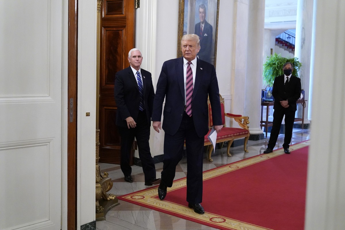 President Donald Trump and Vice President Mike Pence arrive to attend an event called "Kids First: Getting America's Children Safely Back to School" in the State Dining room of the Whit ...