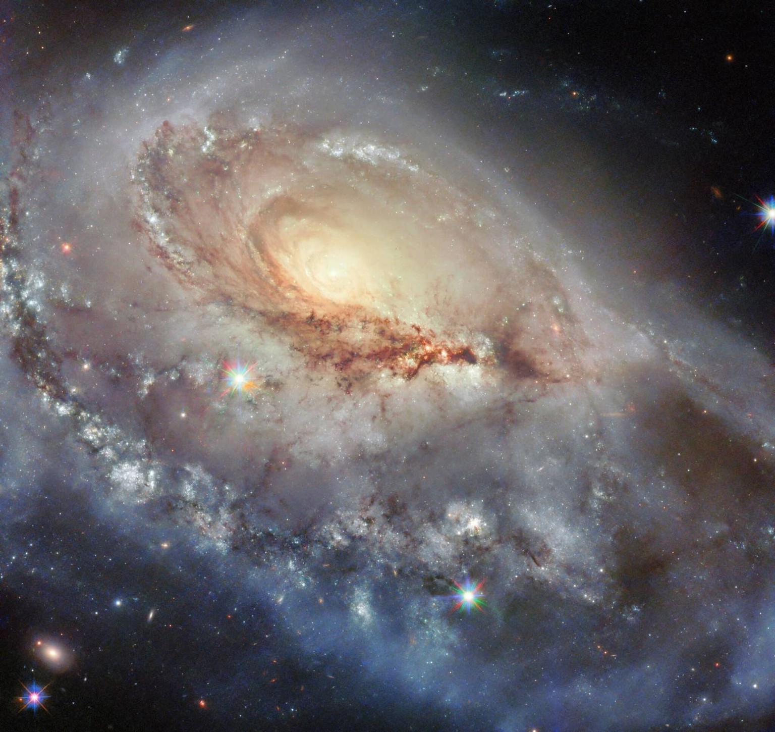 A beautiful but skewed spiral galaxy dazzles in today’s NASA/ESA Hubble Space Telescope Picture of the Week. This galaxy, called Arp 184 or NGC 1961, sits about 190 million light-years away from Earth ...