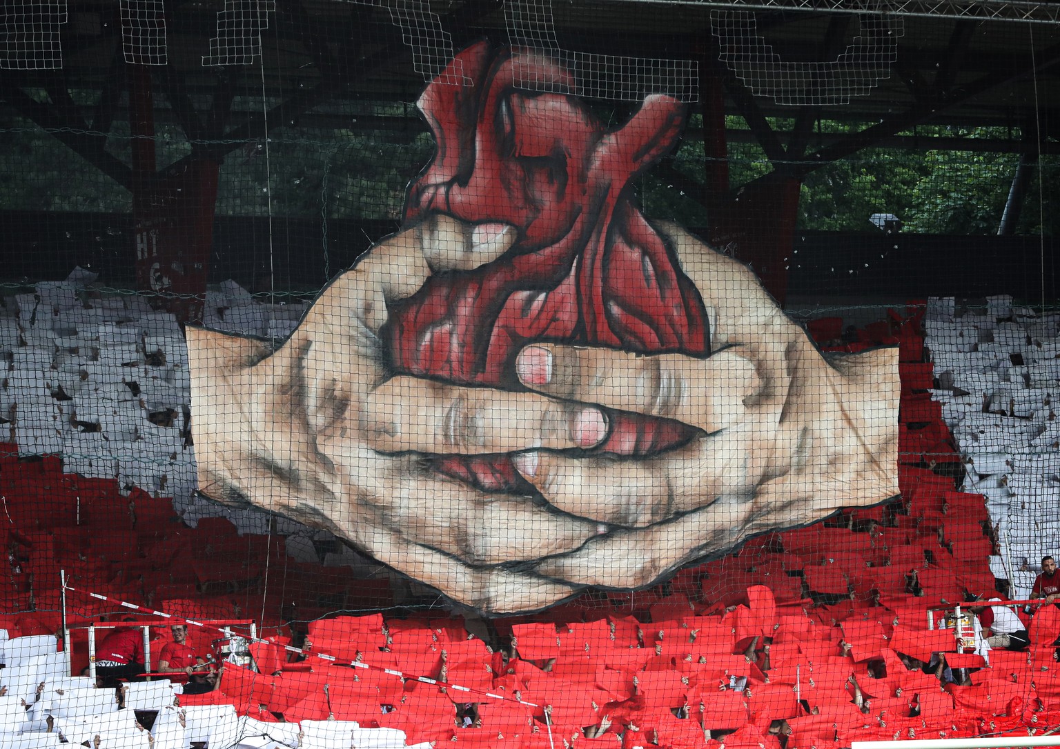 epa07606501 Supporters of FC Union Berlin show a choreography prior to the German Bundesliga relegation play-off second leg soccer match between 1. FC Union Berlin and VfB Stuttgart, in Berlin, German ...