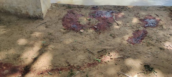 Dried blood stains cover on the floor of a middle school in Let Yet Kone village in Tabayin township in the Sagaing region of Myanmar on Saturday, Sept. 17, 2022, the day after an air strike hit the s ...